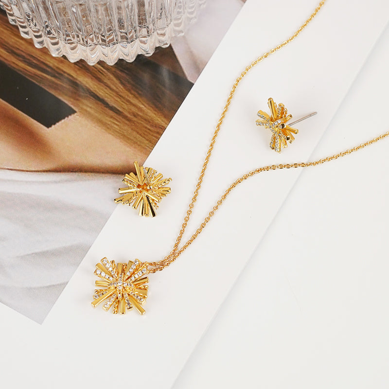 Conjunto de collar y pendientes bañados en oro Starburst