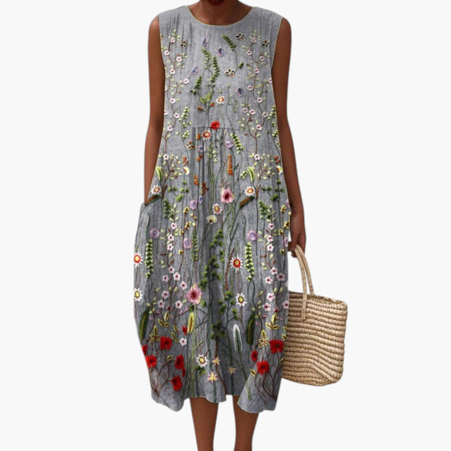 My Store 4 Cara Wildflower midi-jurk in grijs met kleurrijk geborduurde bloemen, mouwloos en van ademende stof.
