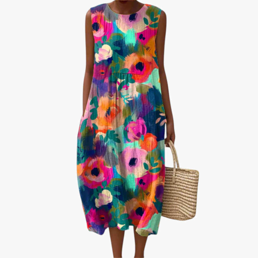 My Store 4 Cora Vibrance midi-jurk met kleurrijke bloemenprint, mouwloos en gemaakt van luchtige stof op het strand.