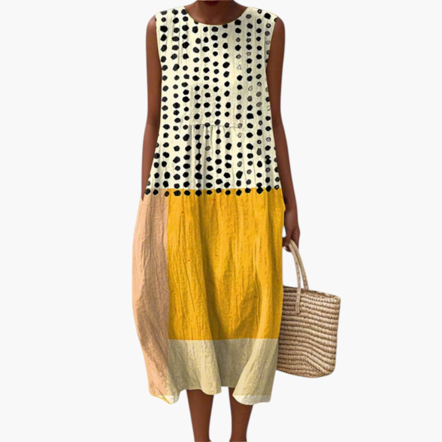 My Store Leah midi jurk met polka dot patroon en kleurvlakken in geel, perzik en crème op het strand